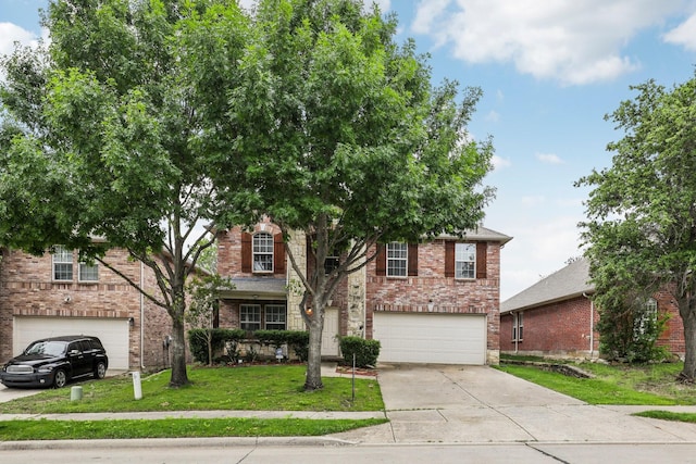 9897 Dartmouth Dr, Frisco, TX 75035 - view of front of house featuring an attached garage, concrete driveway, a front yard, and brick siding