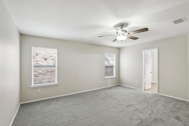 9897 Dartmouth Dr, Frisco, TX 75035 - carpeted empty room featuring ceiling fan, baseboards, and a textured ceiling