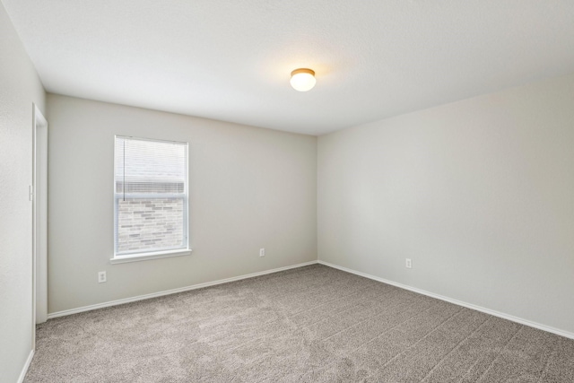 9897 Dartmouth Dr, Frisco, TX 75035 - carpeted empty room featuring baseboards