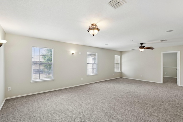 9897 Dartmouth Dr, Frisco, TX 75035 - carpeted empty room with healthy amount of natural light, a ceiling fan, and baseboards