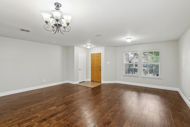 9897 Dartmouth Dr, Frisco, TX 75035 - spare room featuring a chandelier, dark wood finished floors, and baseboards