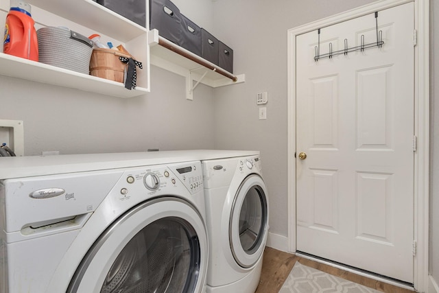 1304 Waterdown Dr, Allen, TX 75013 - washroom featuring washing machine and dryer and wood finished floors