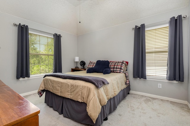 1304 Waterdown Dr, Allen, TX 75013 - bedroom with a textured ceiling, light colored carpet, vaulted ceiling, and baseboards