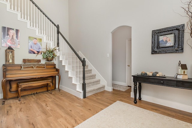 1304 Waterdown Dr, Allen, TX 75013 - entryway with arched walkways, light wood-type flooring, stairway, baseboards, and a high ceiling