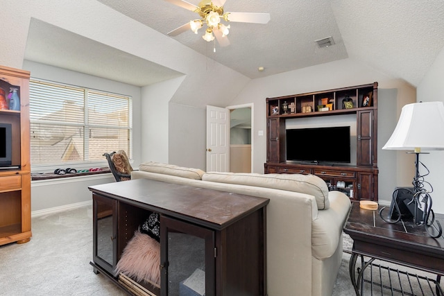 1304 Waterdown Dr, Allen, TX 75013 - living room with vaulted ceiling, ceiling fan, light colored carpet, and a textured ceiling