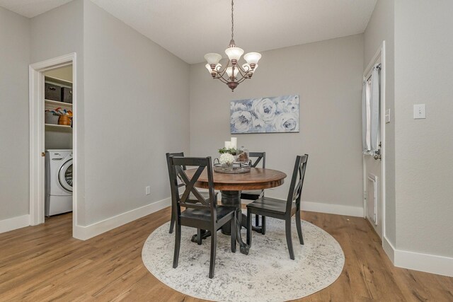 1304 Waterdown Dr, Allen, TX 75013 - dining room featuring washer / dryer, light wood-style floors, a chandelier, and baseboards
