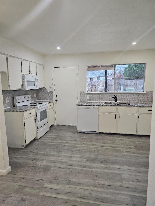 5233 Kingston Ct, Abilene, TX 79605 - kitchen featuring white appliances, a sink, white cabinetry, recessed lighting, and light wood finished floors