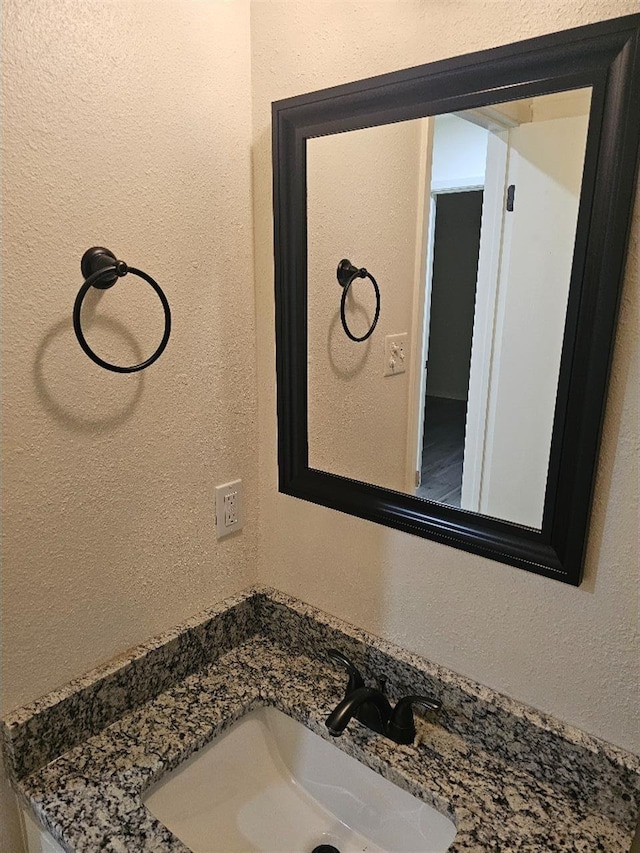 5233 Kingston Ct, Abilene, TX 79605 - bathroom featuring vanity and a textured wall