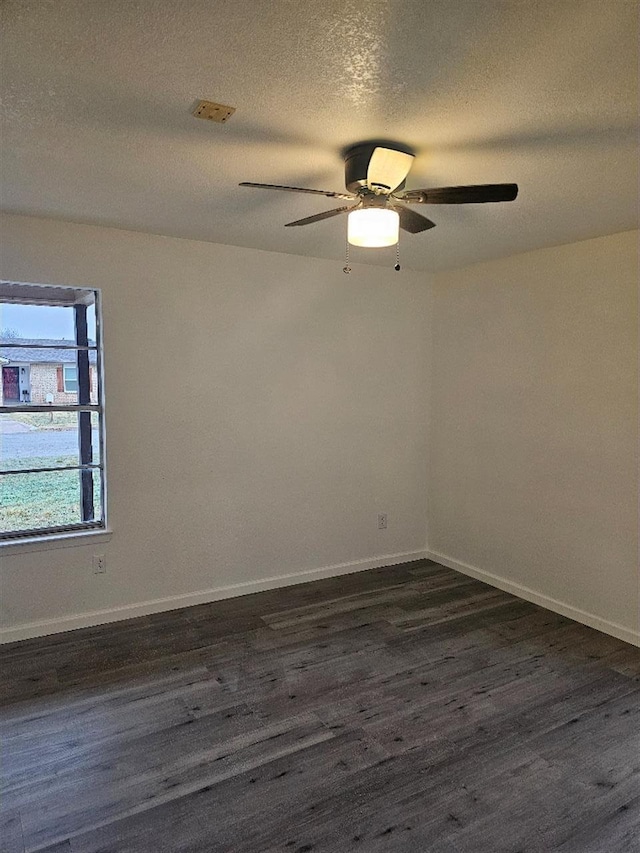 5233 Kingston Ct, Abilene, TX 79605 - spare room with dark wood finished floors, a ceiling fan, baseboards, and a textured ceiling