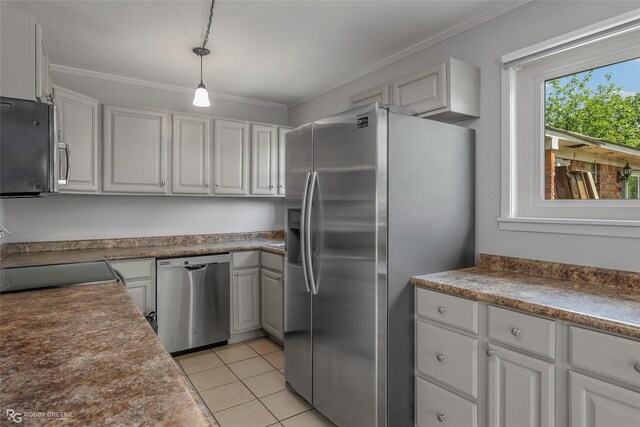 3238 Schuler Dr, Bossier City, LA 71112 - kitchen with stainless steel appliances, ornamental molding, white cabinets, light tile patterned floors, and hanging light fixtures