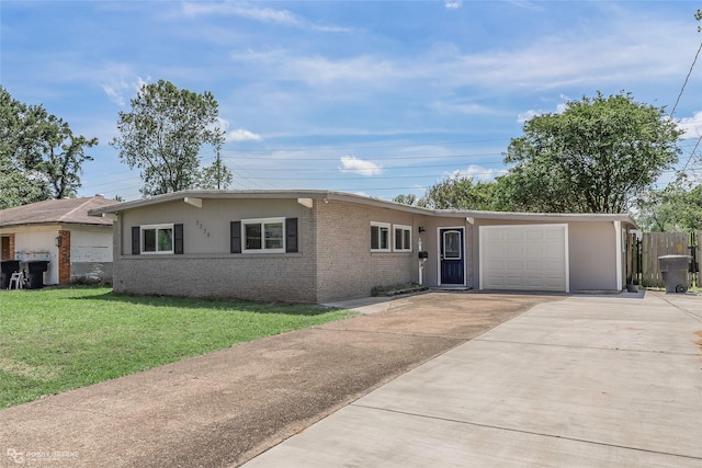 3238 Schuler Dr, Bossier City, LA 71112 - ranch-style house with driveway, a front yard, a garage, brick siding, and stucco siding