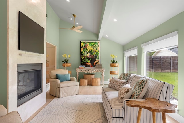 4016 Goodfellow Dr, Dallas, TX 75229 - living room featuring vaulted ceiling, wood finished floors, healthy amount of natural light, a ceiling fan, and a fireplace