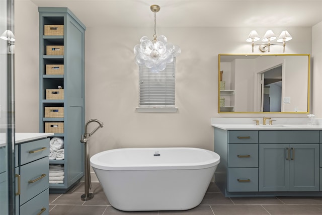 4016 Goodfellow Dr, Dallas, TX 75229 - bathroom with vanity, a freestanding tub, a chandelier, and tile patterned flooring