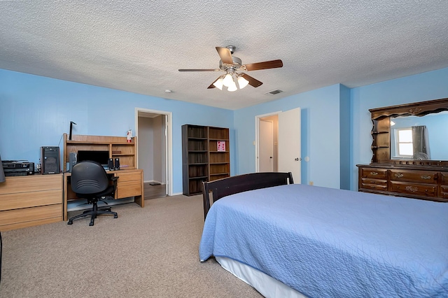 3929 Wrenwood Dr, Fort Worth, TX 76137 - bedroom with a desk, light carpet, ceiling fan, and a textured ceiling