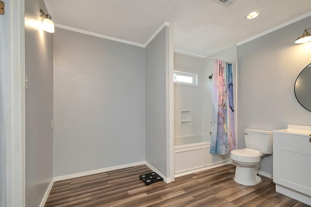 3929 Wrenwood Dr, Fort Worth, TX 76137 - bathroom featuring ornamental molding, vanity, toilet, wood finished floors, and shower / bathtub combination with curtain
