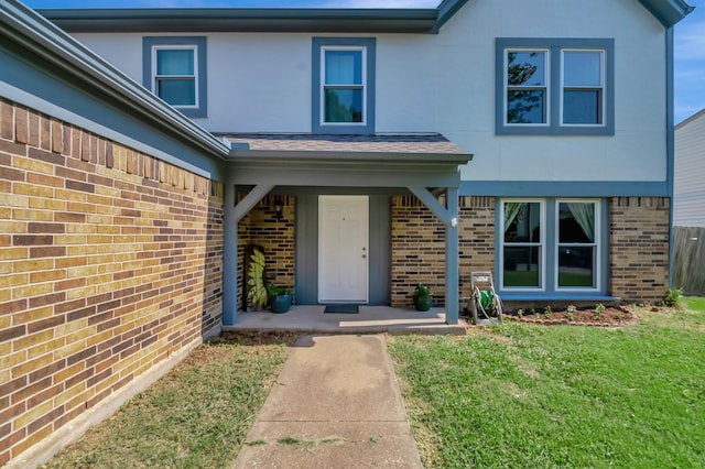 3929 Wrenwood Dr, Fort Worth, TX 76137 - entrance to property featuring brick siding, a lawn, and stucco siding