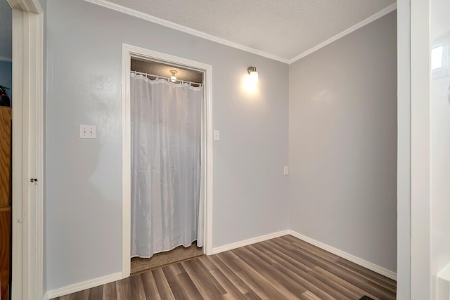 3929 Wrenwood Dr, Fort Worth, TX 76137 - unfurnished room with dark wood-type flooring, baseboards, ornamental molding, and a textured ceiling