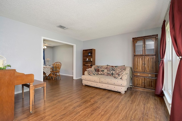 3929 Wrenwood Dr, Fort Worth, TX 76137 - living room featuring wood finished floors, baseboards, and a textured ceiling