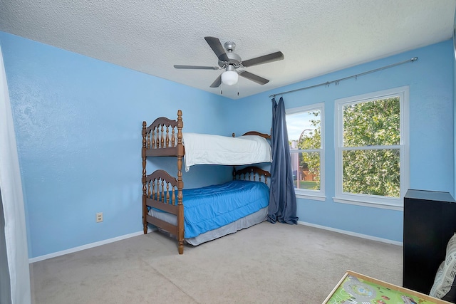 3929 Wrenwood Dr, Fort Worth, TX 76137 - carpeted bedroom featuring baseboards, a textured ceiling, and ceiling fan