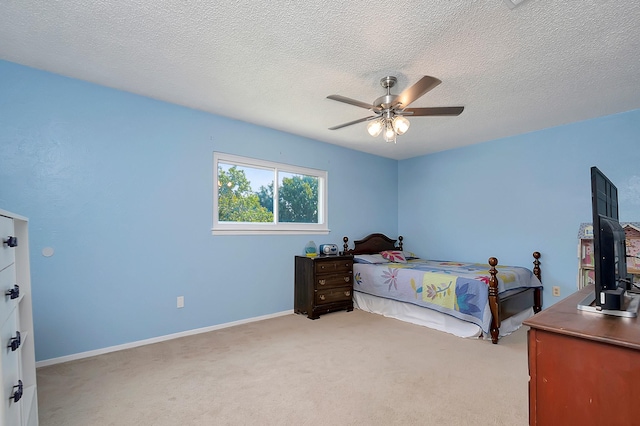 3929 Wrenwood Dr, Fort Worth, TX 76137 - bedroom with light carpet, a ceiling fan, a textured ceiling, and baseboards