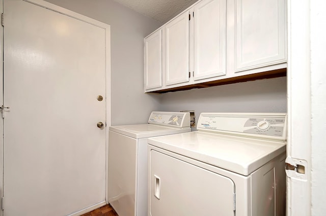 3929 Wrenwood Dr, Fort Worth, TX 76137 - laundry room featuring washing machine and clothes dryer, cabinet space, and a textured ceiling