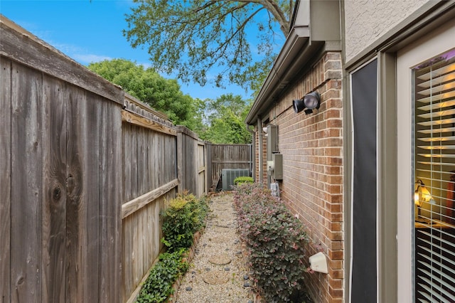422 Arbor Creek Dr, Euless, TX 76039 - view of side of home with brick siding and central AC unit