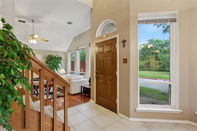 422 Arbor Creek Dr, Euless, TX 76039 - foyer with light tile patterned flooring, vaulted ceiling, ceiling fan, and baseboards