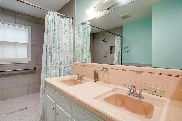 4524 Morris Ct, Fort Worth, TX 76103 - full bath featuring a tile shower and double vanity
