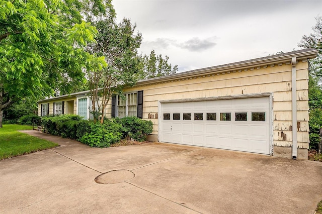 4524 Morris Ct, Fort Worth, TX 76103 - ranch-style house with concrete driveway and a garage