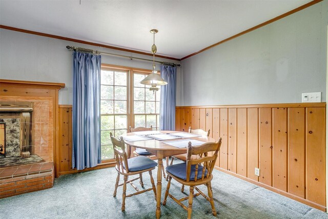 4524 Morris Ct, Fort Worth, TX 76103 - dining space featuring crown molding, healthy amount of natural light, carpet, wainscoting, and wooden walls