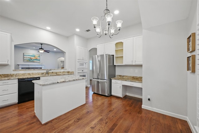 1325 Capstan Dr, Allen, TX 75013 - kitchen with white appliances, a sink, white cabinetry, arched walkways, and open shelves