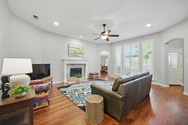1325 Capstan Dr, Allen, TX 75013 - living room featuring arched walkways, ceiling fan, wood finished floors, baseboards, and recessed lighting