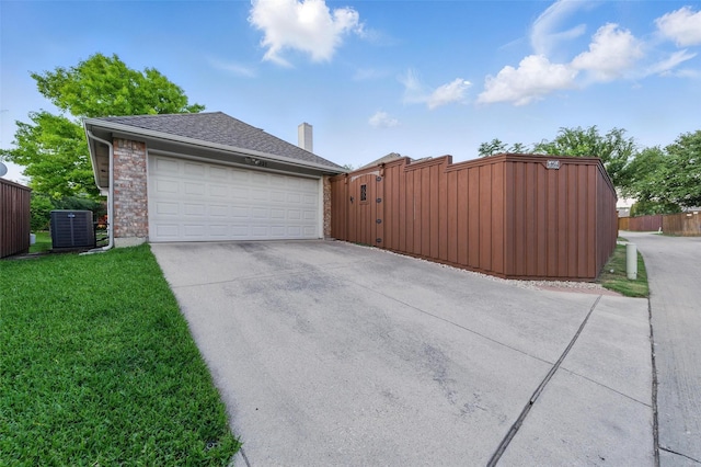 1325 Capstan Dr, Allen, TX 75013 - garage featuring central air condition unit and driveway