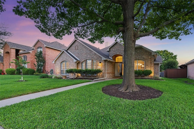 1325 Capstan Dr, Allen, TX 75013 - view of front of house with brick siding and a yard