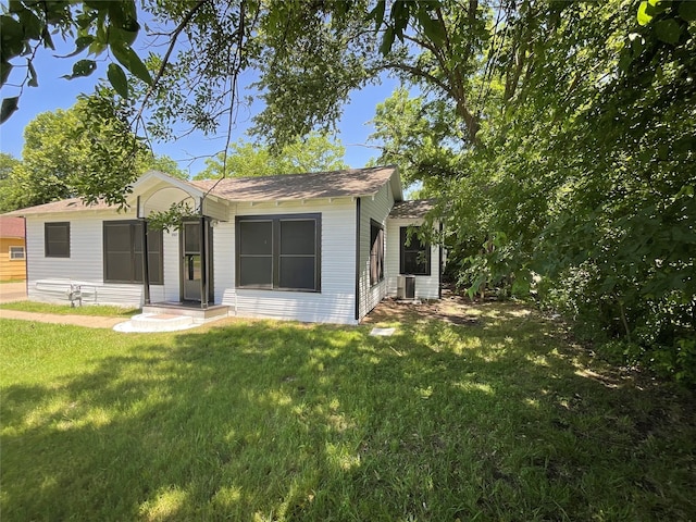207 Bellview St, Sulphur Springs, TX 75482 - view of front of home featuring a front yard and roof with shingles