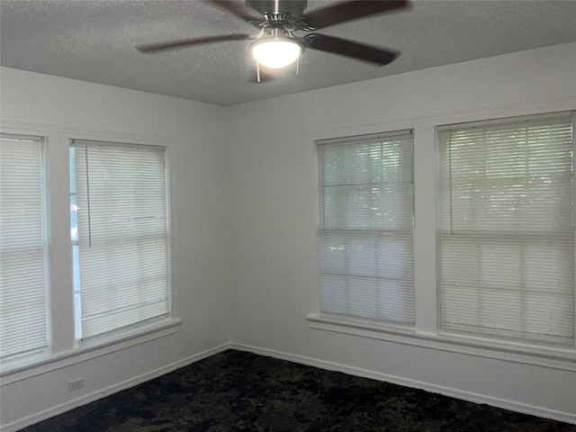 207 Bellview St, Sulphur Springs, TX 75482 - empty room with dark colored carpet, ceiling fan, and baseboards