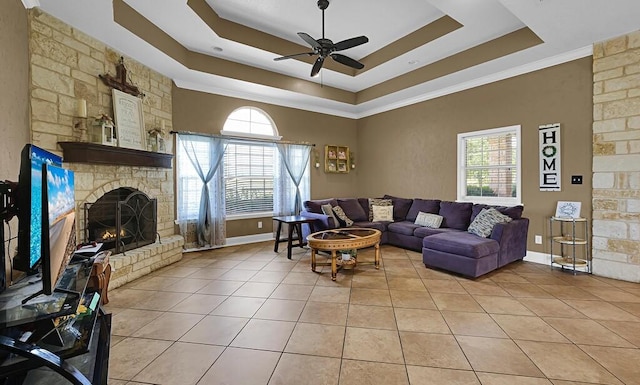 355 Texas 236 Hwy, Moody, TX 76557 - living area featuring a tray ceiling, light tile patterned flooring, a ceiling fan, and healthy amount of natural light