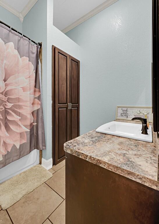 355 Texas 236 Hwy, Moody, TX 76557 - full bath featuring ornamental molding, vanity, tile patterned flooring, and shower / bath combination with curtain