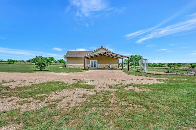 355 Texas 236 Hwy, Moody, TX 76557 - view of home's exterior with a carport, dirt driveway, and stone siding