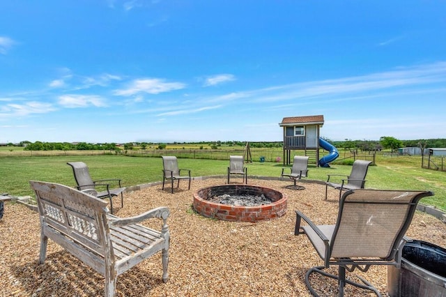 355 Texas 236 Hwy, Moody, TX 76557 - view of yard featuring a playground, a fire pit, and a view of rural / pastoral area