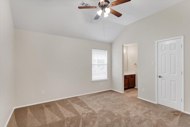 11538 Corsicana Dr, Frisco, TX 75035 - unfurnished bedroom with light colored carpet, lofted ceiling, ensuite bathroom, baseboards, and a ceiling fan