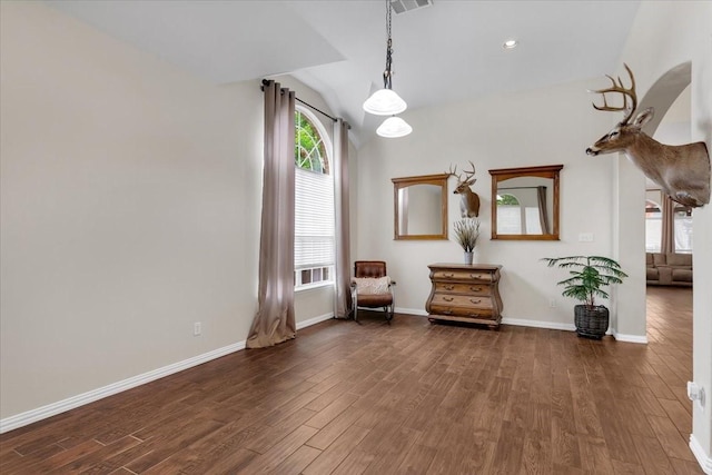 11538 Corsicana Dr, Frisco, TX 75035 - sitting room with wood finished floors, baseboards, and vaulted ceiling