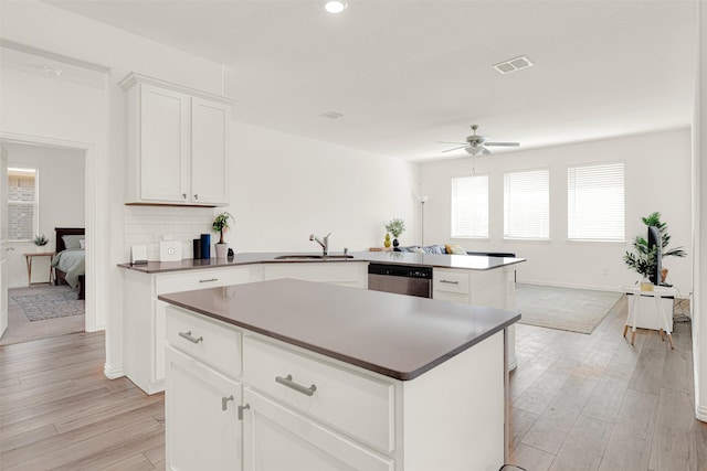 511 Poplar St, Princeton, TX 75407 - kitchen featuring stainless steel dishwasher, a sink, ceiling fan, a center island, and a peninsula