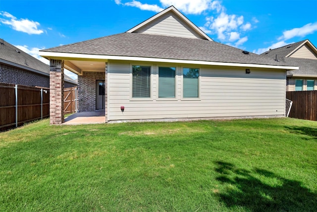 511 Poplar St, Princeton, TX 75407 - rear view of house with a patio and a shingled roof