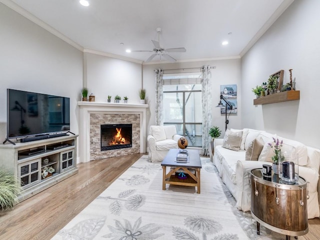 3204 Wycliff Ave Unit 3216, Dallas, TX 75219 - living room featuring wood finished floors, ornamental molding, a ceiling fan, a fireplace, and recessed lighting