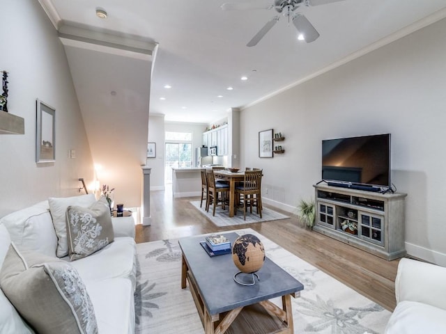 3204 Wycliff Ave Unit 3216, Dallas, TX 75219 - living area with light wood finished floors, a ceiling fan, recessed lighting, baseboards, and crown molding