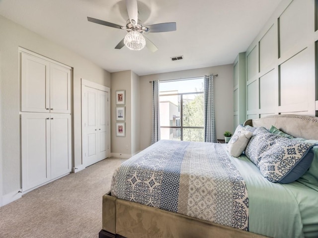 3204 Wycliff Ave Unit 3216, Dallas, TX 75219 - bedroom with light carpet, two closets, a ceiling fan, and baseboards