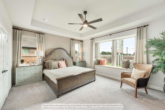 1107 Peacock Ln, Wylie, TX 75098 - carpeted bedroom featuring a raised ceiling, baseboards, and a ceiling fan