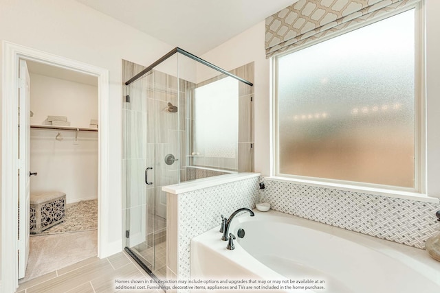 1107 Peacock Ln, Wylie, TX 75098 - bathroom with a garden tub, a shower stall, and a spacious closet