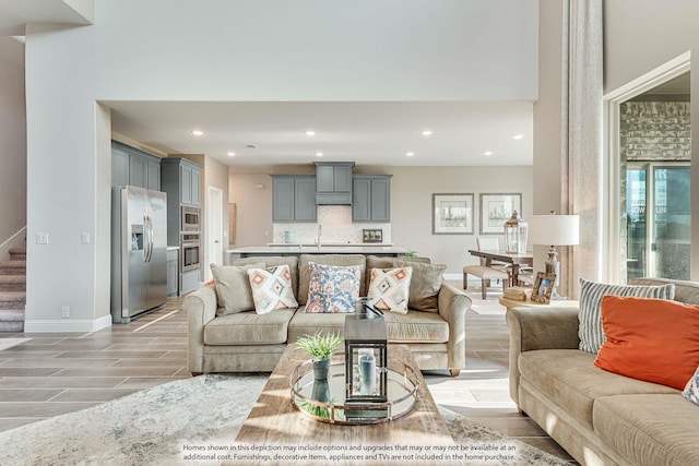 1107 Peacock Ln, Wylie, TX 75098 - living area with baseboards, recessed lighting, and stairway